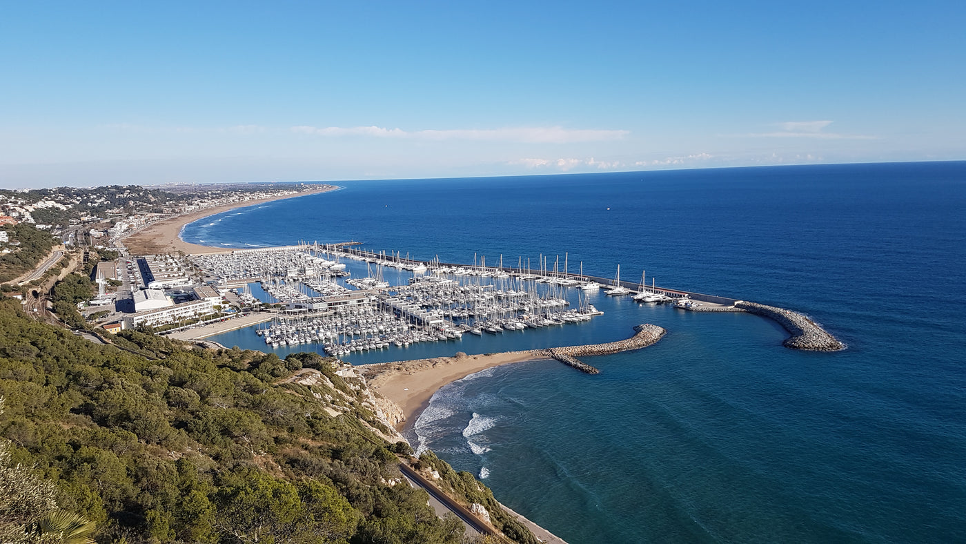 Aerial view of port ginesta with boats and a beach. Home of Jetsurf Barcelona.